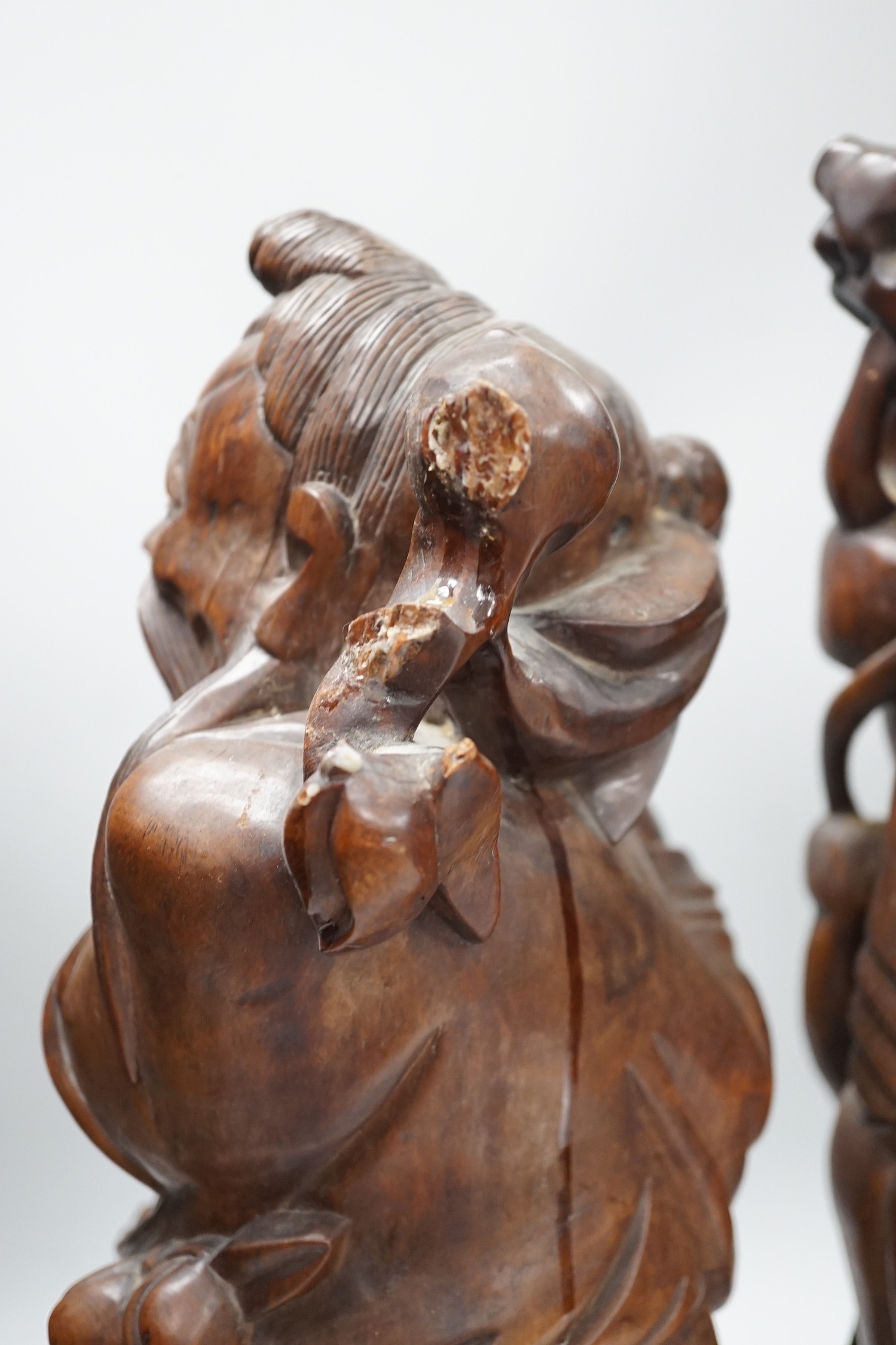 Two Chinese hardwood figures of luohans, early 20th century Tallest 48cm